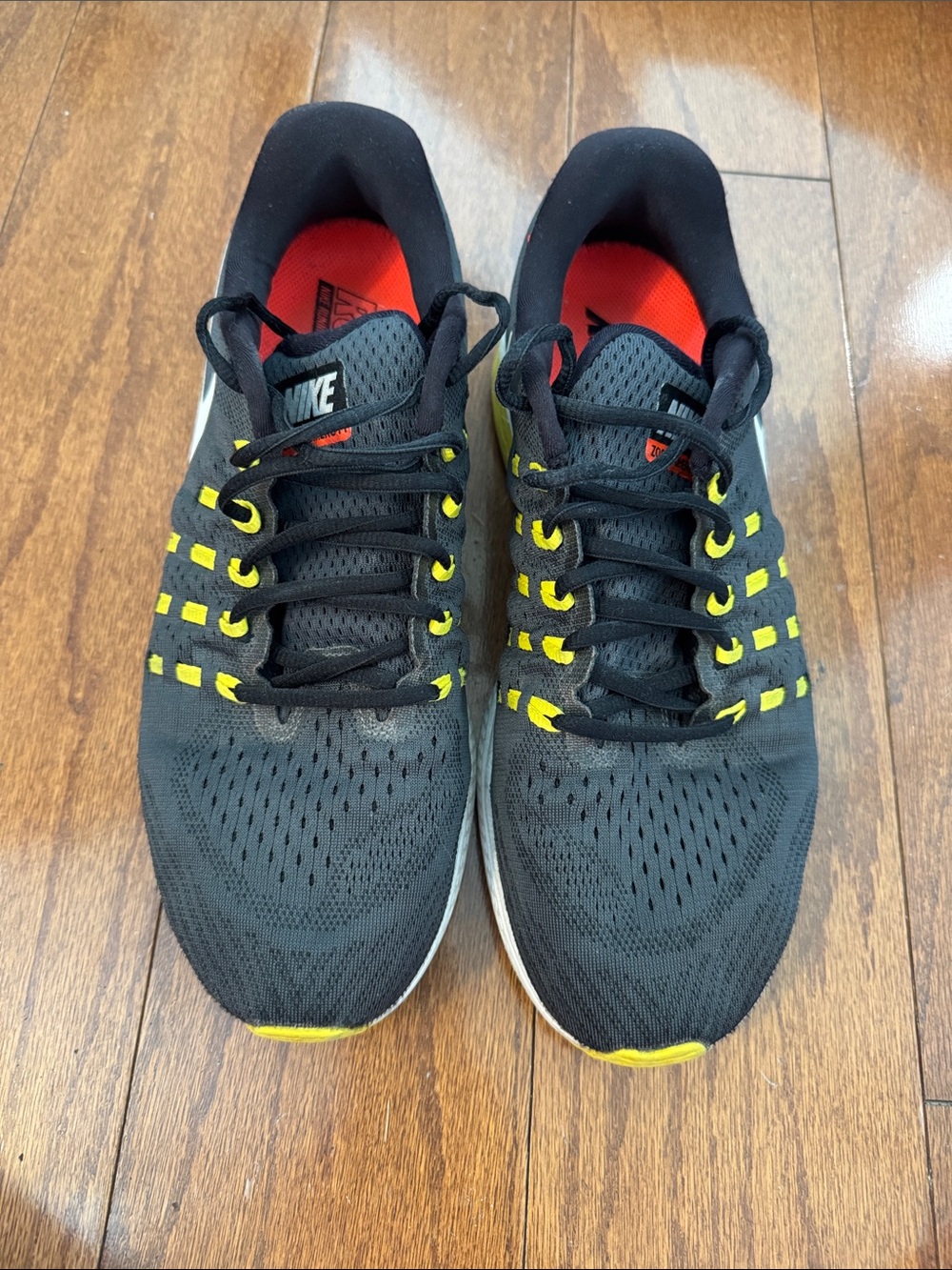 Nike Men’s Vomero 11 Black Athletic Shoes with Yellow and Red Accents